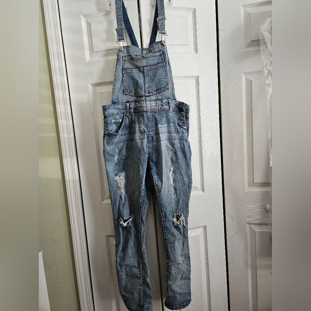Distressed denim overalls
